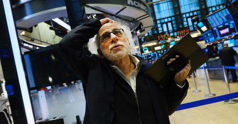 A stock market trader looking worried