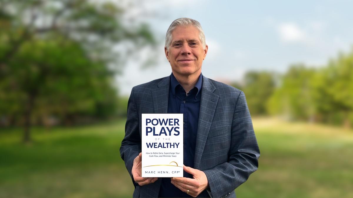 marc henn with his book