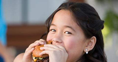 A girl eating a burger