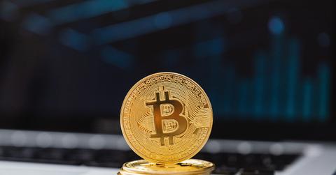 Gold Bitcoin on a laptop