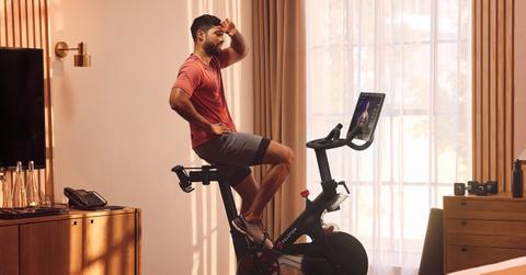 A man using a Peloton bike