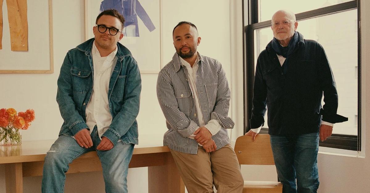 Mickey Drexler (R) stands in an office with his son, Alex Drexler (L) and fashion designer Somsack Sikhounmuong.