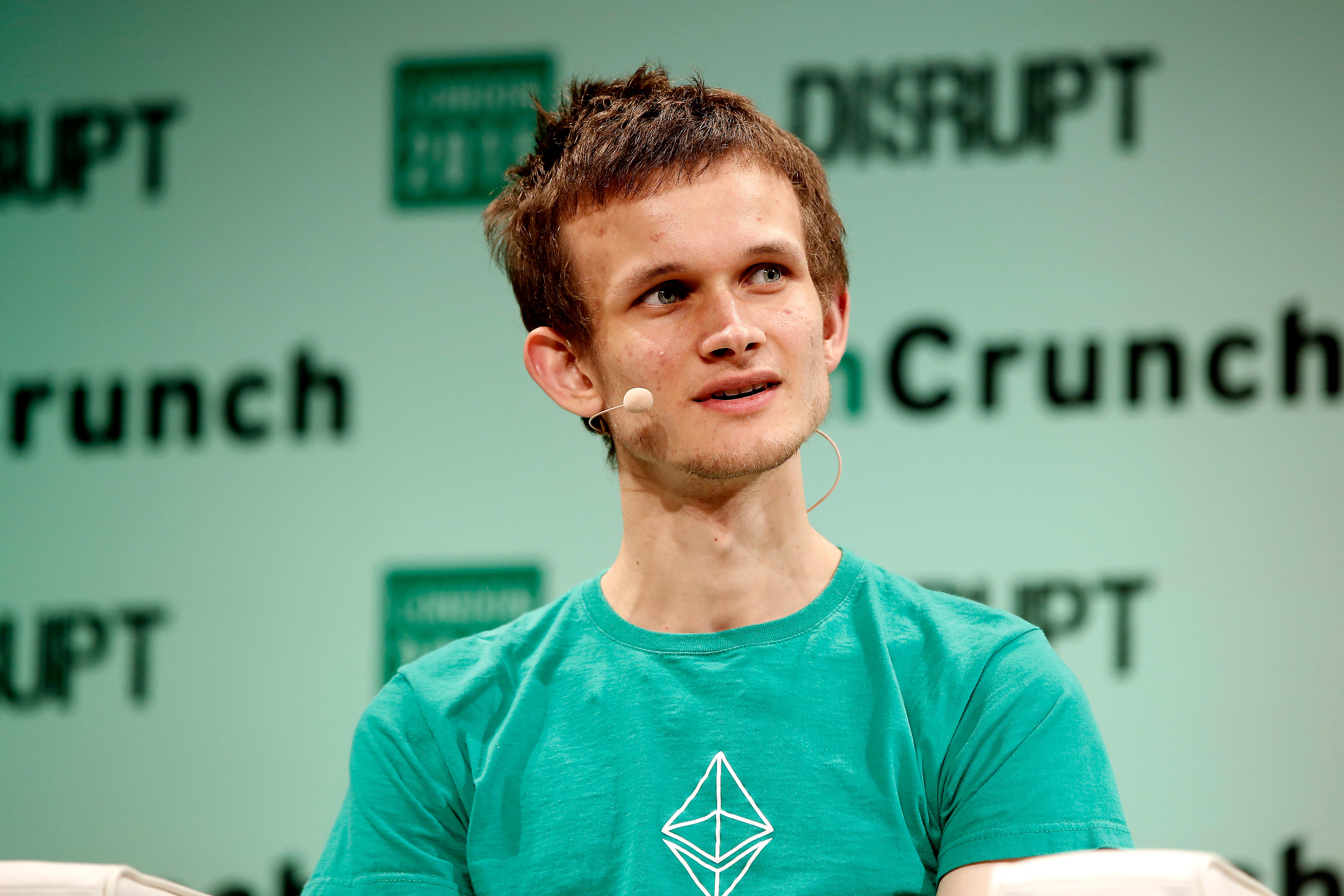 Vitalik Buterin giving cryptocurrency talk on stage