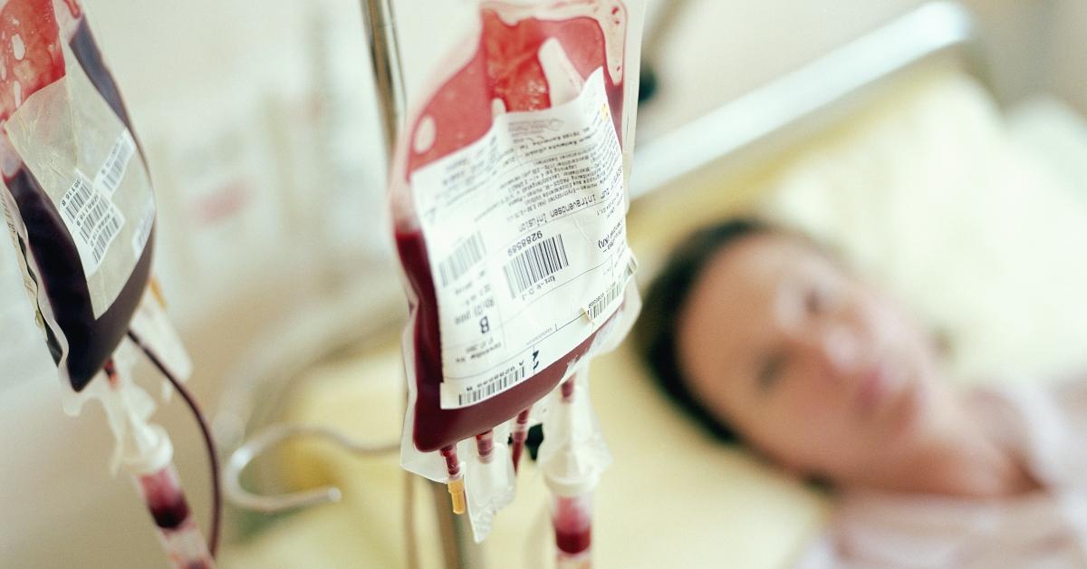 A woman receiving a blood transfusion