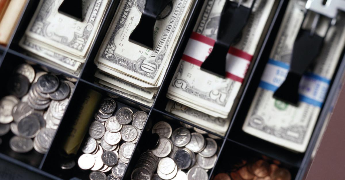 Cash register with U.S. currency