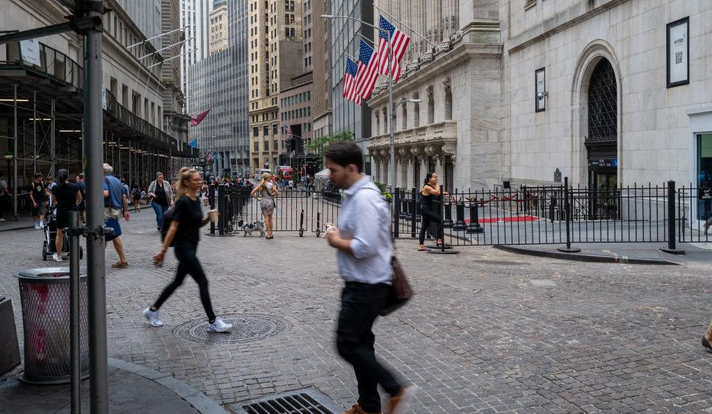 People walking on Wall Street