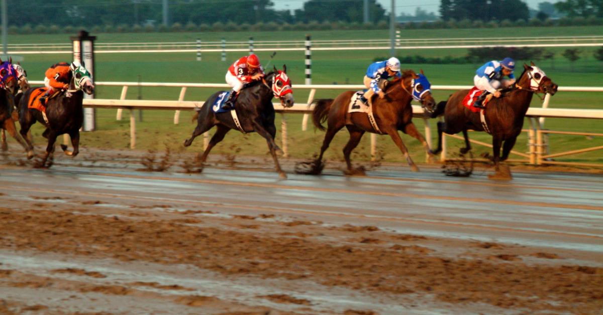 Horses running on a racetrack