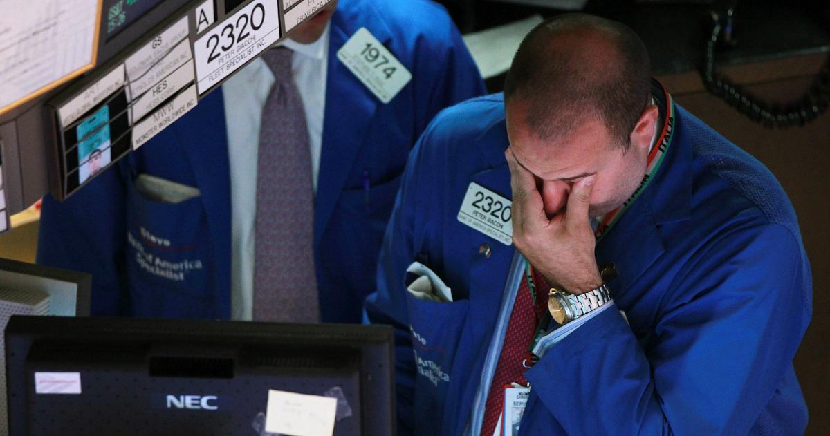 Worried trader as stocks fall in global recession