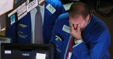 Worried trader as stocks fall in global recession
