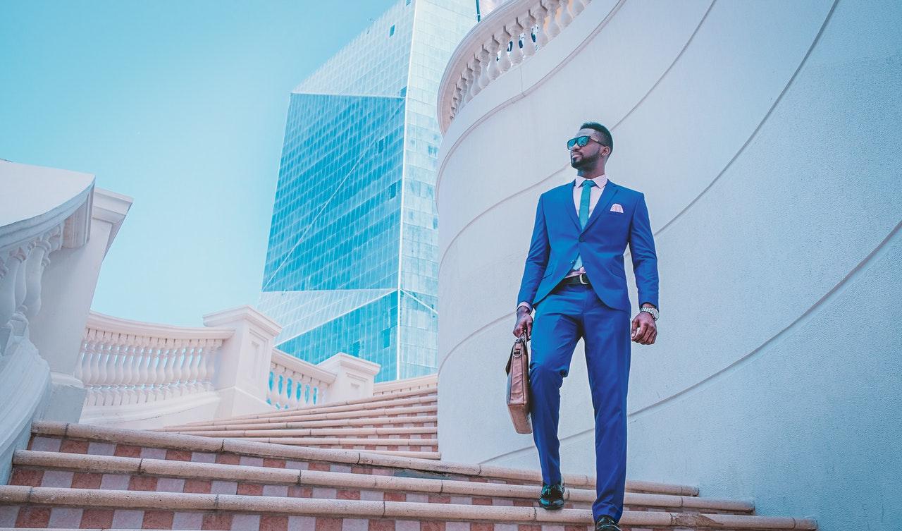 A businessperson walking down stairs