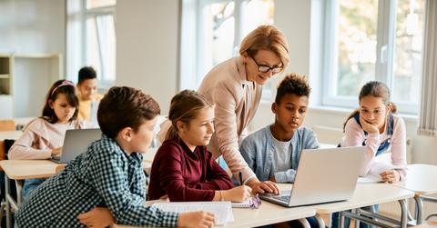 A teacher working with students