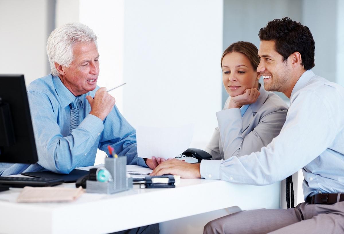 Financial planner helping a couple with their future investment