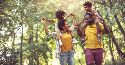 A couple walking with their children