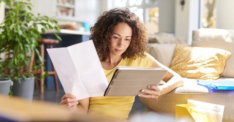 Woman looking at a tablet.