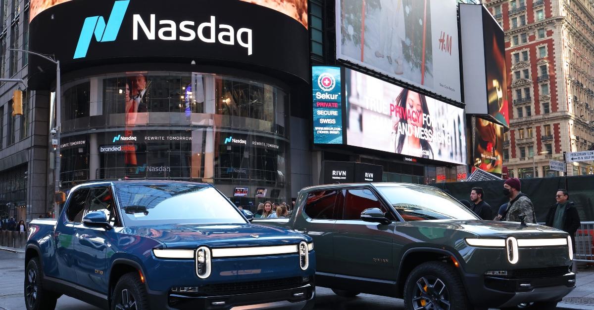 Rivian cars parked in front of the Nasdaq exchange