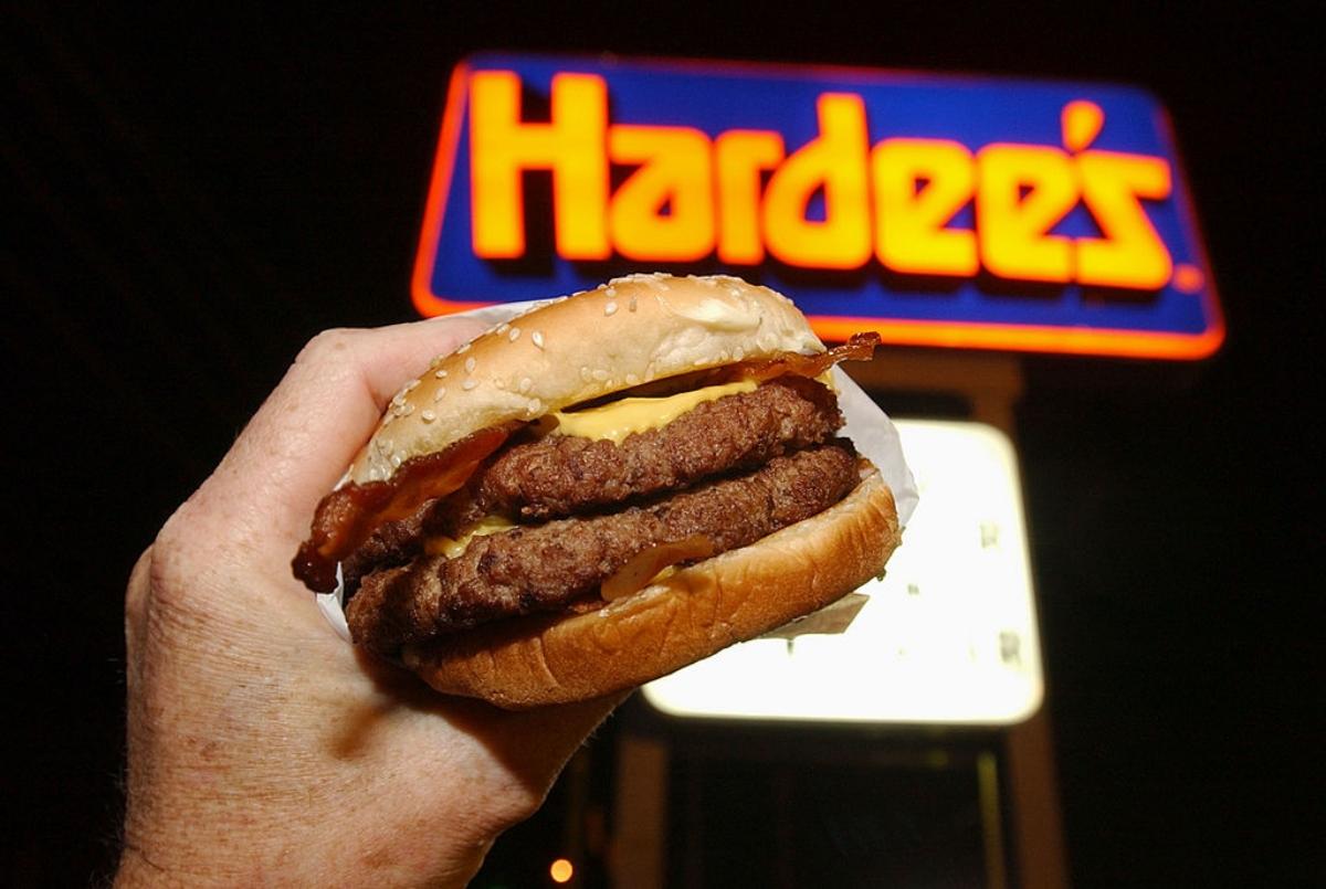 A Hardee's sign with double burger