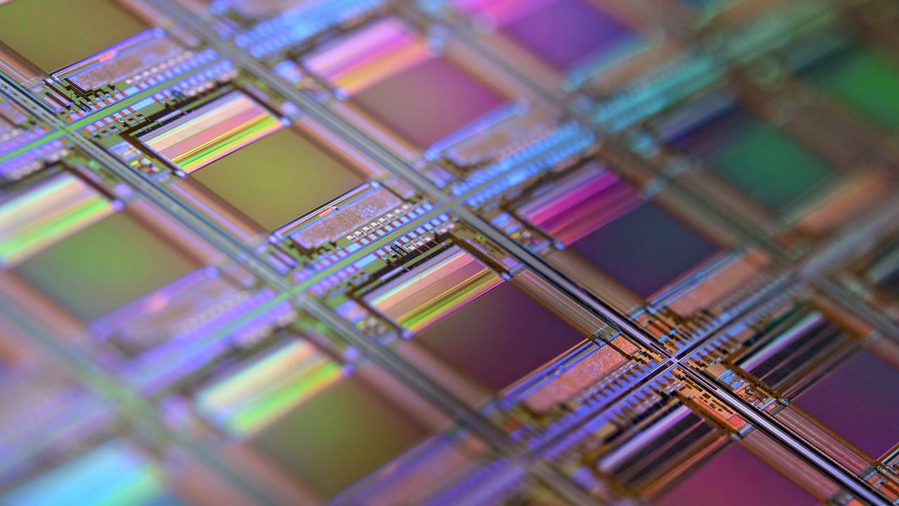 A microchip silicon wafer under a microscope