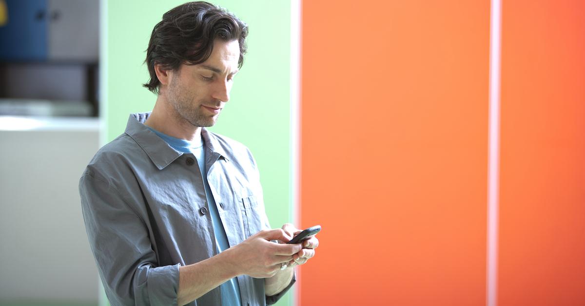 Young man holding phone