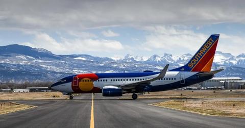 A Southwest Airlines plane waiting for takeoff on the runway.