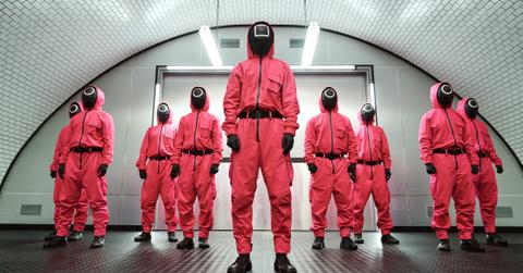 Squid Game TV show people in red jumpsuits