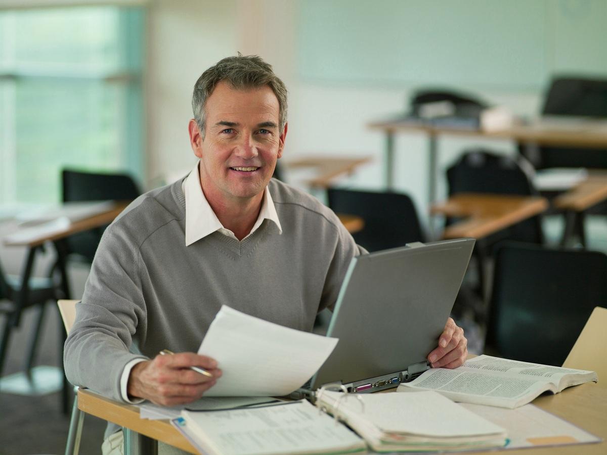 A man looking at data for CD rates