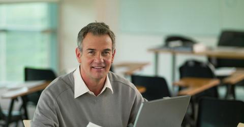 A man looking at data for CD rates