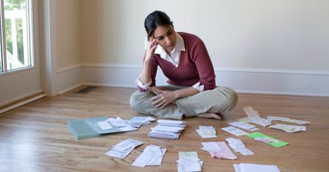 Woman looking at bills