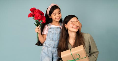 A child giving their mother a gift