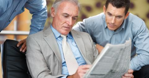 Men looking at stock information