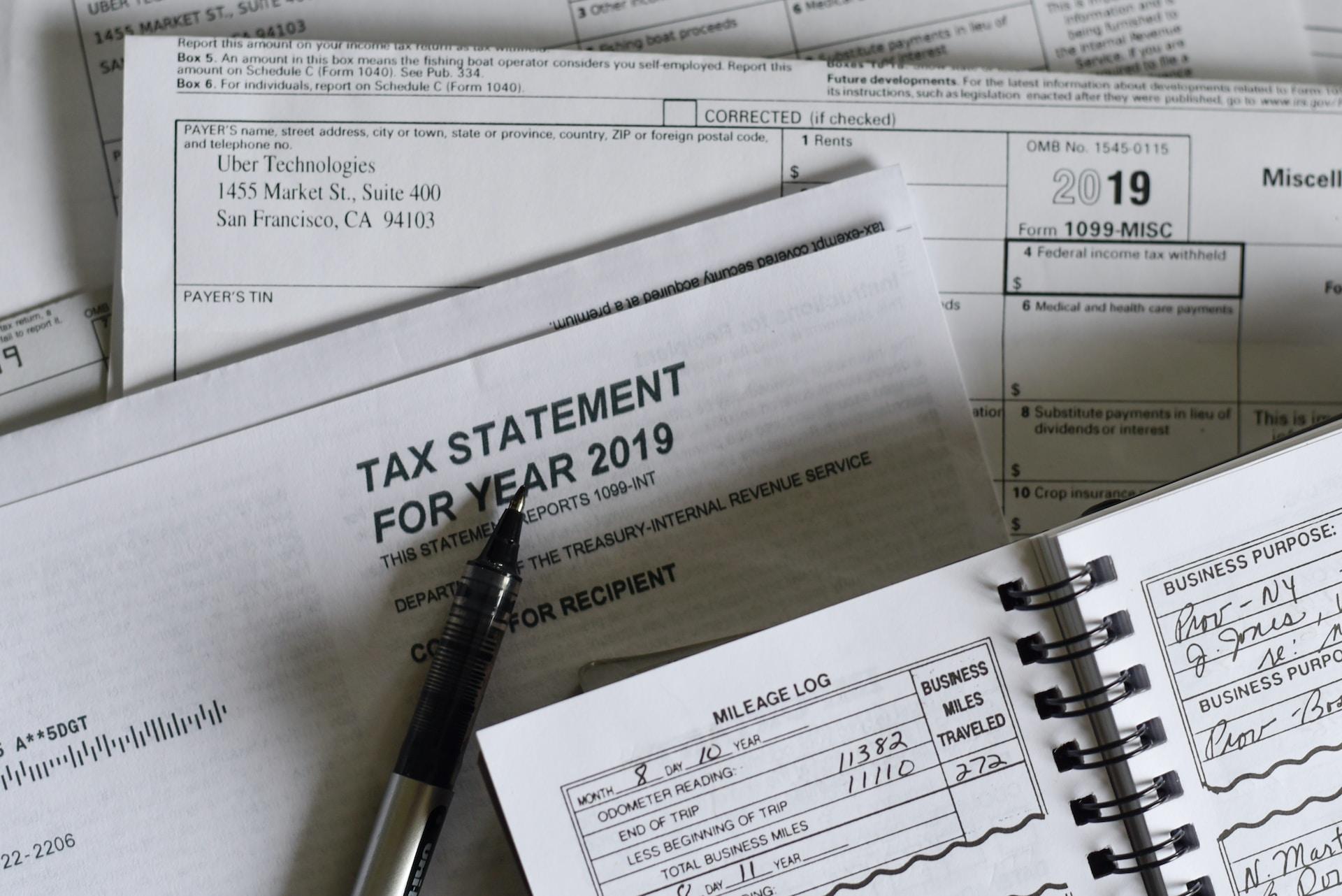 Tax statement for year 2019 form with a black pen sitting on top