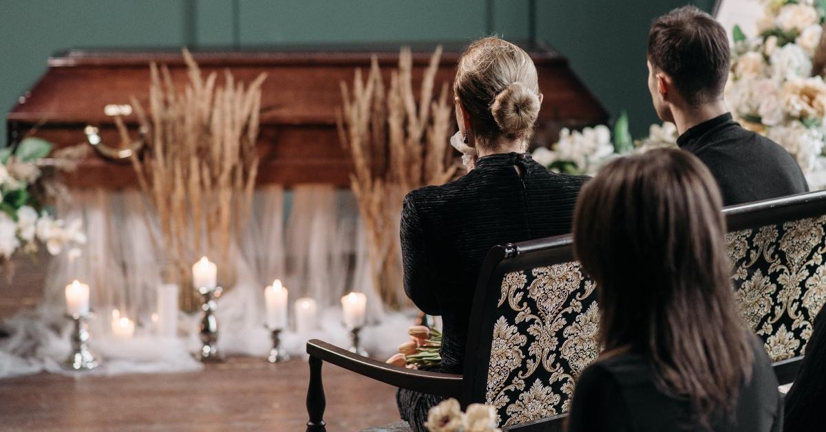 People sitting at a funeral