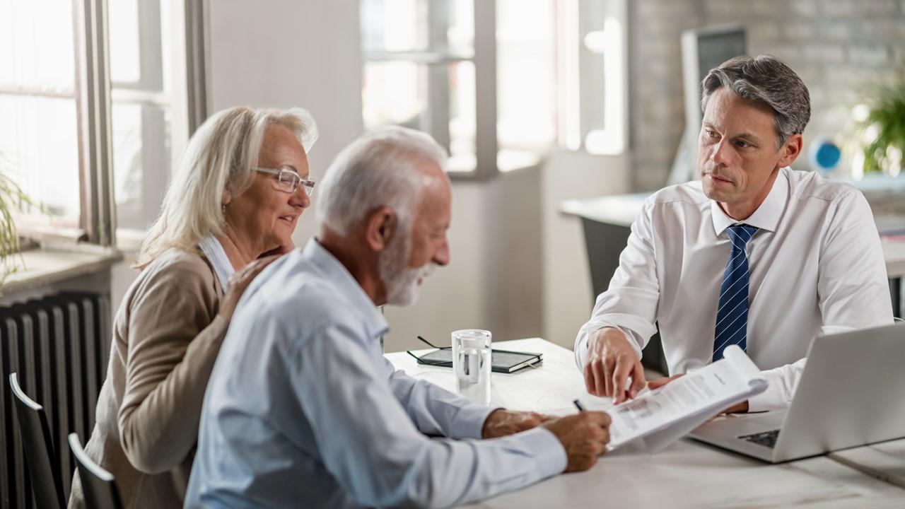 A couple signing their estate plan