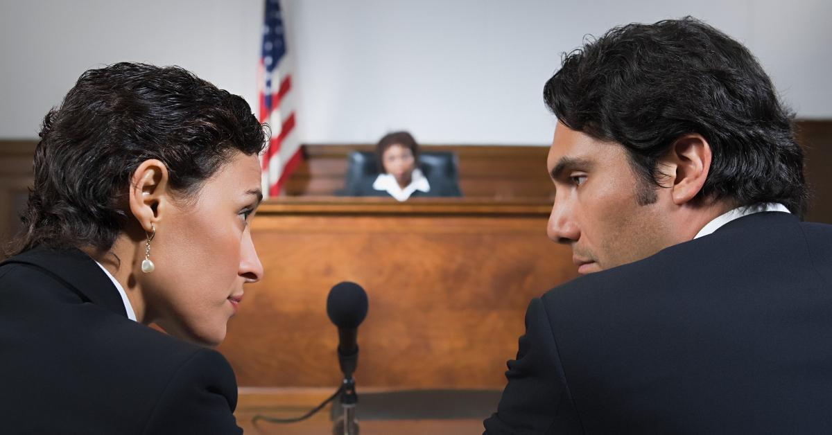 A public defender and client in court