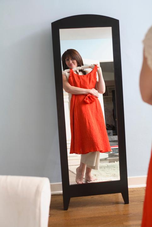 A woman trying on a dress