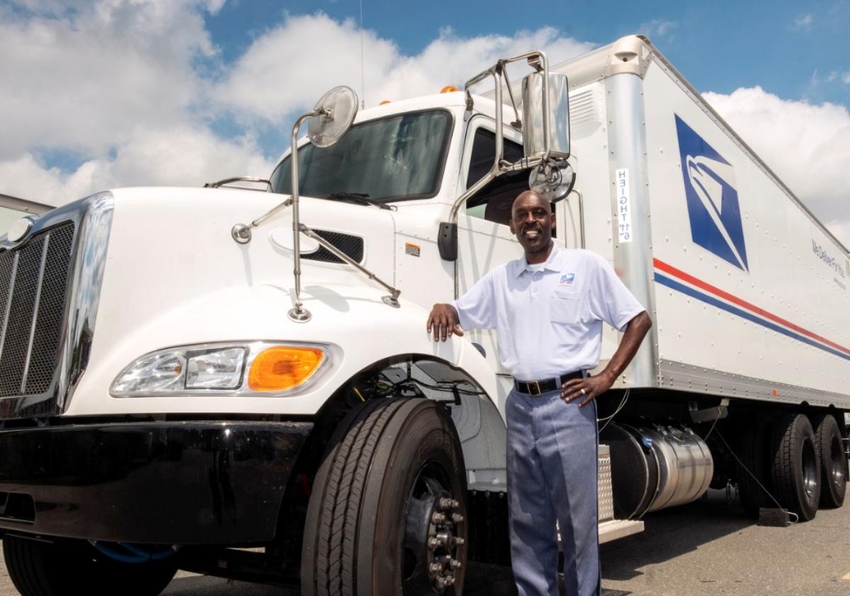 USPS truck and worker