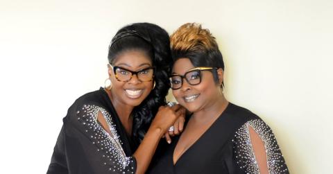 Diamond and Silk pose together in black and silver tops.