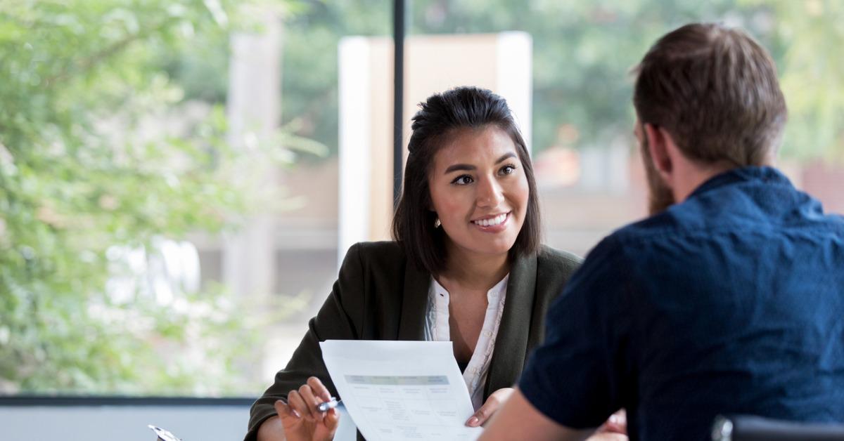 cheerful businesswoman meets with client picture id