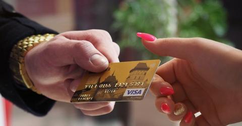 People exchanging a debit card