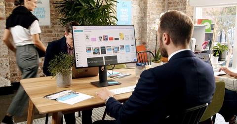 Person using Canva at work desk