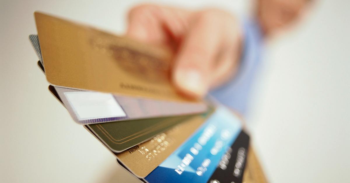 A person holding credit cards