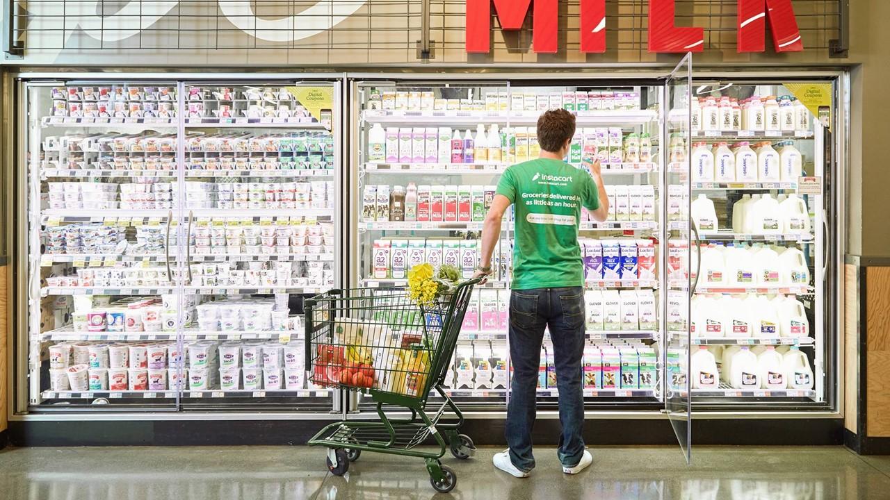 An Instacart shopper at a grocery store