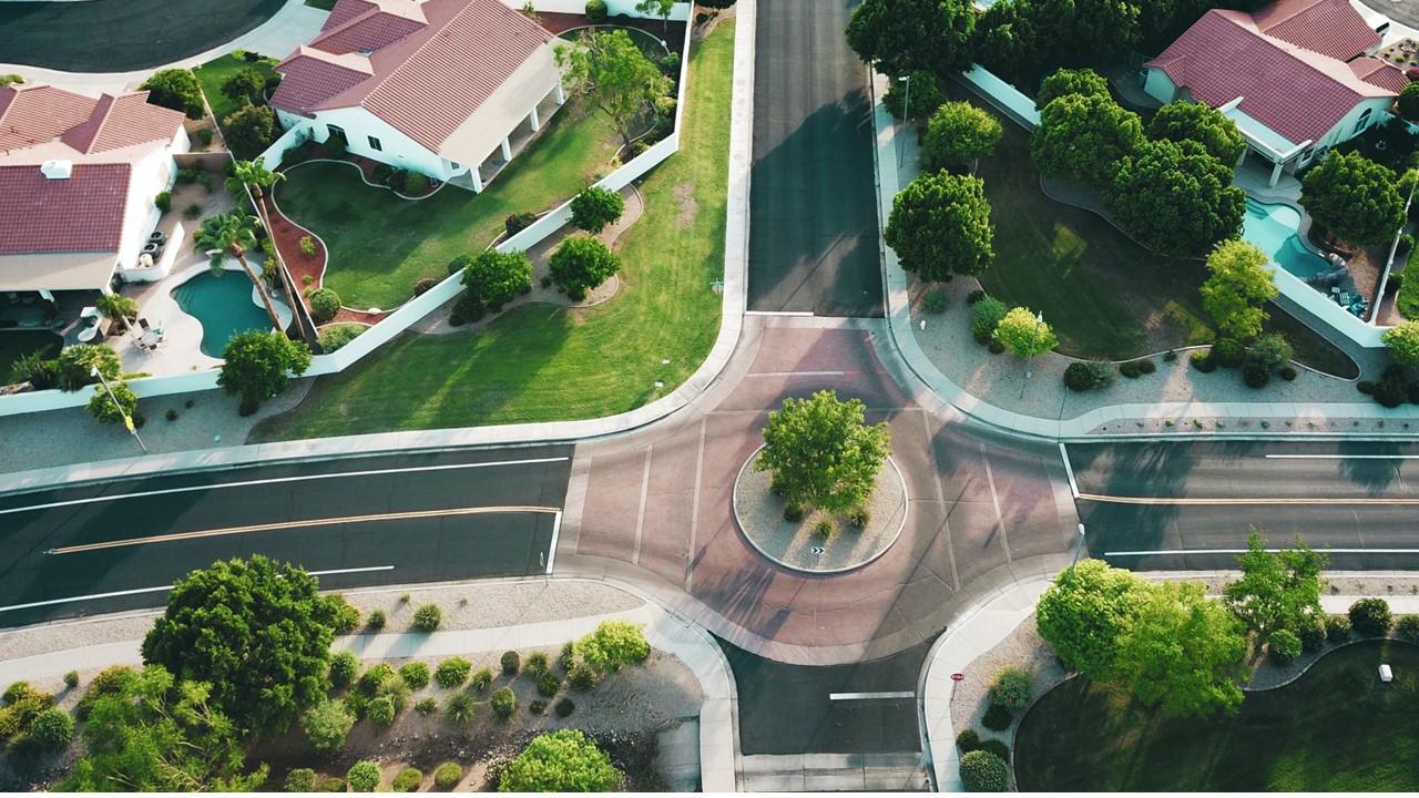 suburb neighborhood intersection with houses on corner