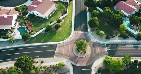 suburb neighborhood intersection with houses on corner