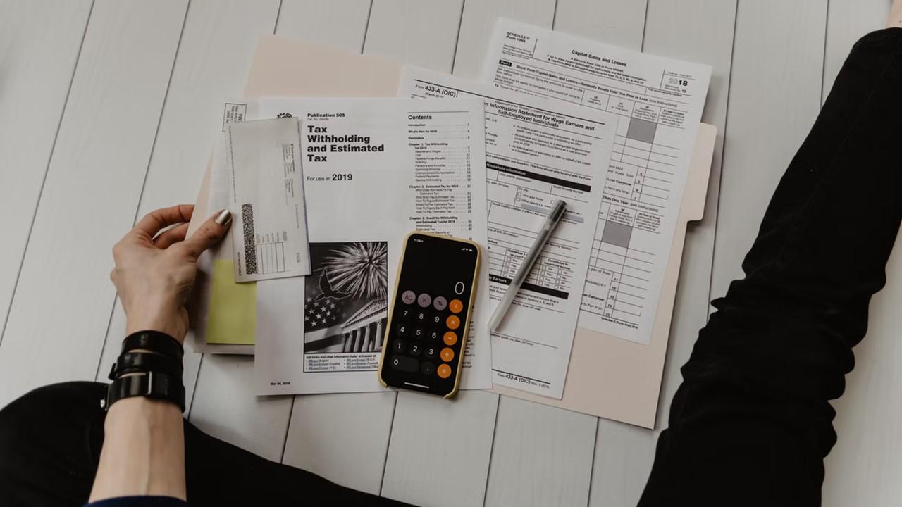 A woman looking at tax documents