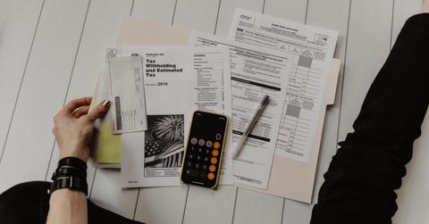 A woman looking at tax documents