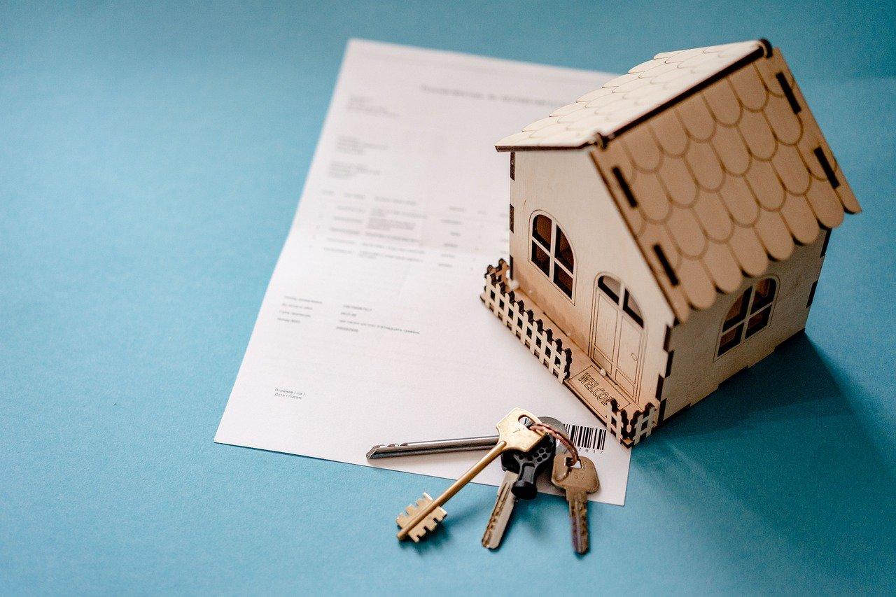 House miniature with keys and paperwork