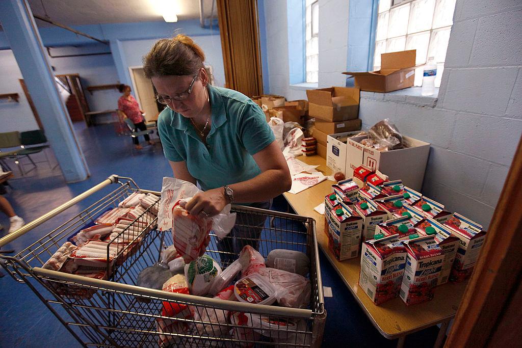 A woman prepares food baskets 