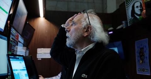 A stock trader looking at data