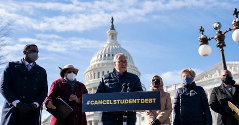 Senator Schumer and other members of congress speak in favor of student loan forgiveness outside the U.S. Capitol