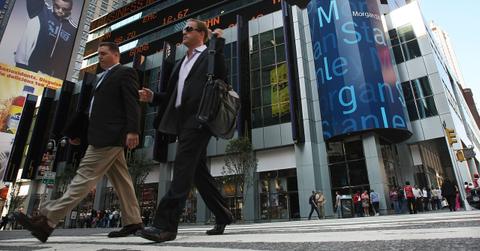 Men walking by Morgan Stanley headquarters